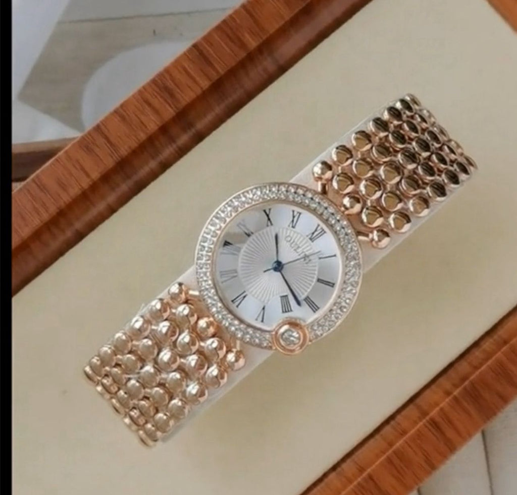 ساعة نسائية أنيقة من OULINI – تصميم دائري مرصع، أرقام رومانية، كوارتز، باللون الروز جولد LRMW 20234