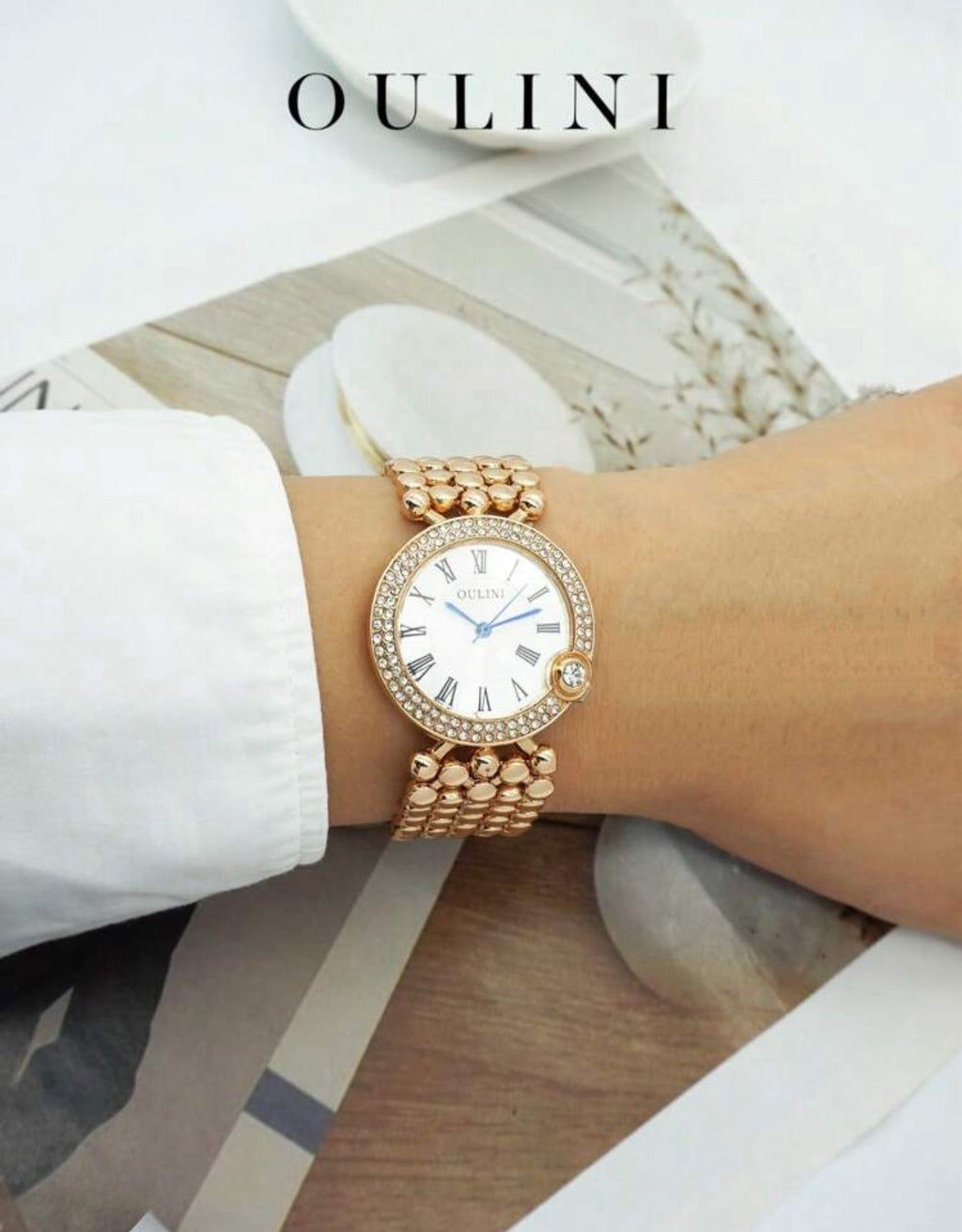 ساعة نسائية أنيقة من OULINI – تصميم دائري مرصع، أرقام رومانية، كوارتز، باللون الروز جولد LRMW 20234